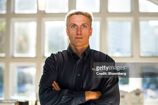 Lyndon Rive, co-founder and chief executive officer of SolarCity Corp., stands for a photograph after an interview in San Francisco, California,...