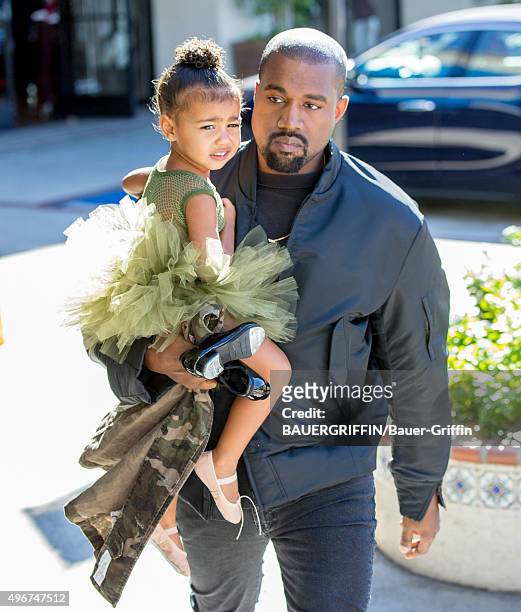 Kanye West and North West are seen on November 11, 2015 in Los Angeles, California.