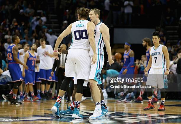 Cody Zeller celebrates with teammate Spencer Hawes of the Charlotte Hornets after hitting the game winning shot to defeat the New York Knicks 95-93...