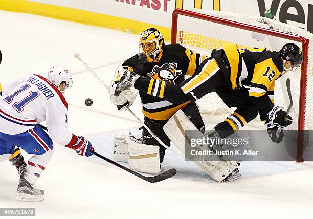 Marc-Andre Fleury of the Pittsburgh Penguins and defenseman Ben Lovejoy defend against Brendan Gallagher of the Montreal Canadiens at Consol Energy...