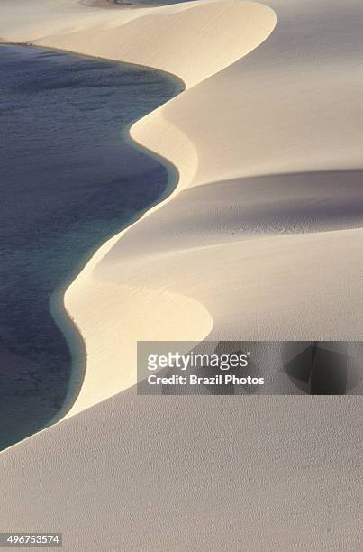 The Lencois Maranhenses National Park , composed of large, white, sweeping dunes, at first glance it looks like an archetypal desert, but lying just...