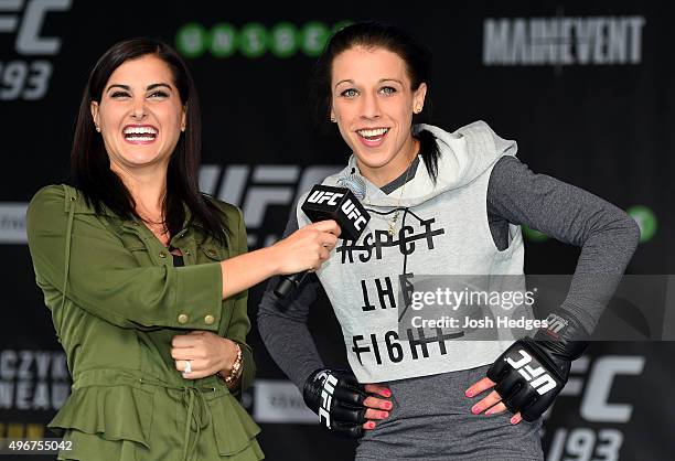 Women's strawweight champion Joanna Jedrzejczyk of Poland is interviewed by Megan Olivi after an open workout for fans and media at Federation Square...