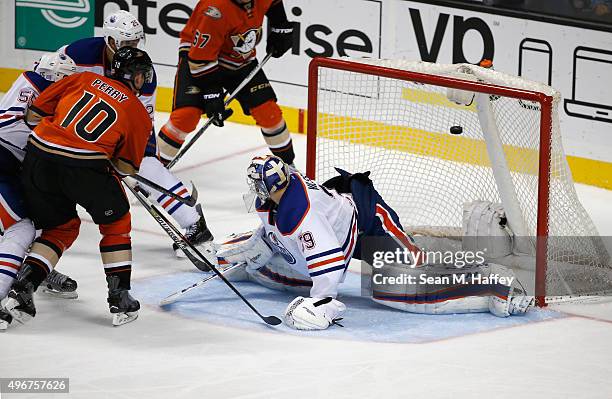 Corey Perry of the Anaheim Ducks scores a goal as Mark Fayne of the Edmonton Oilers and Anders Nilsson of the Edmonton Oilers defend during the third...