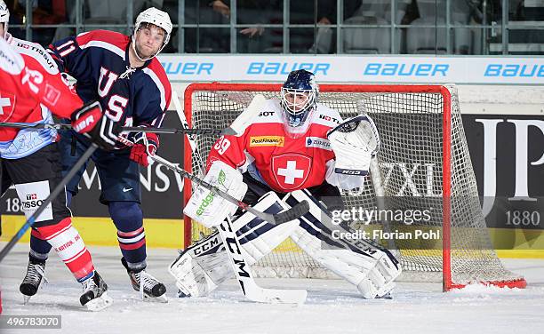 Ben Hanowski of Team USA and Sandro Zurkirchen of Team Swiss during the game between Swiss against USA on november 7, 2015 in Augsburg, Germany.