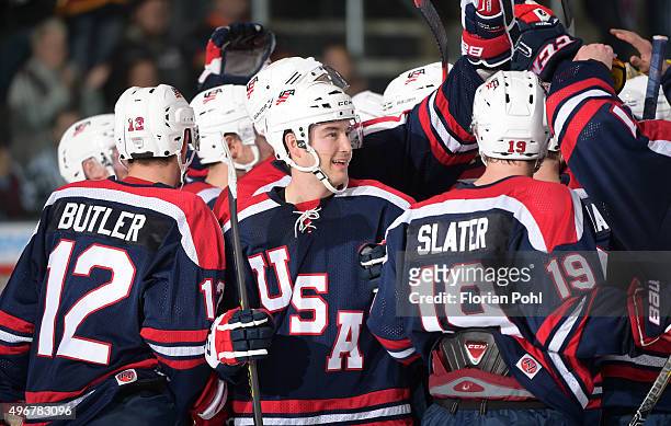 Bobby Butler, Casey Wellman and Jim Slater of Team USA celebrate the win ueber die Swiss after the game Swiss against die USA on november 7, 2015 in...