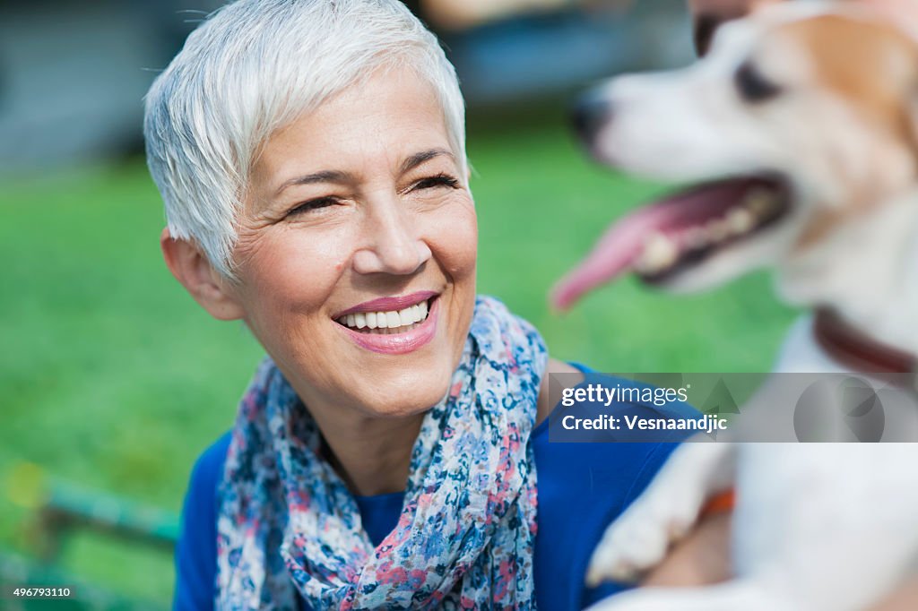 Woman with dog at the city