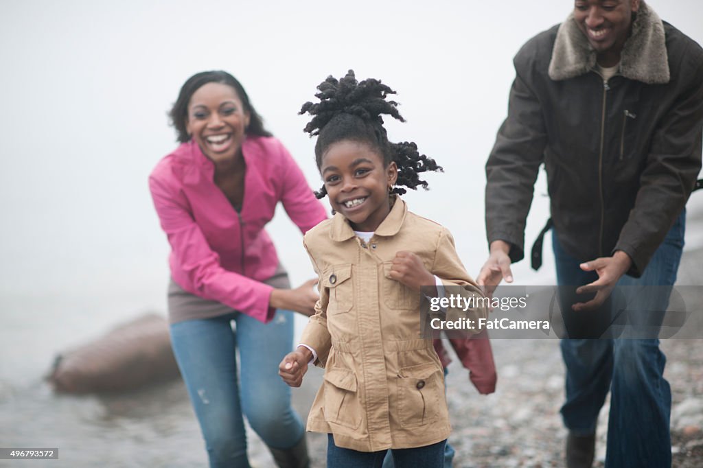 Family Playing Near the Waters Edge