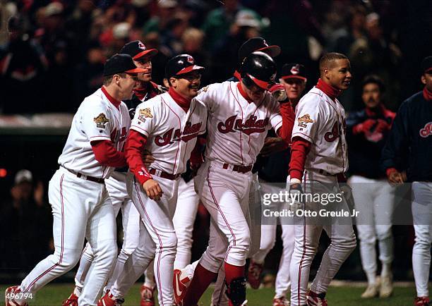 Jim Thome of the Cleveland Indians tips his hat as teammates walk out onto the field during a game against the Atlanta Braves at the Jacobs Field in...