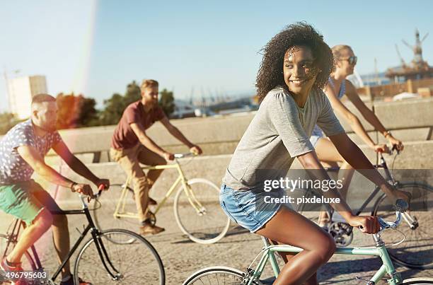 living while they're young - friends cycling stock pictures, royalty-free photos & images