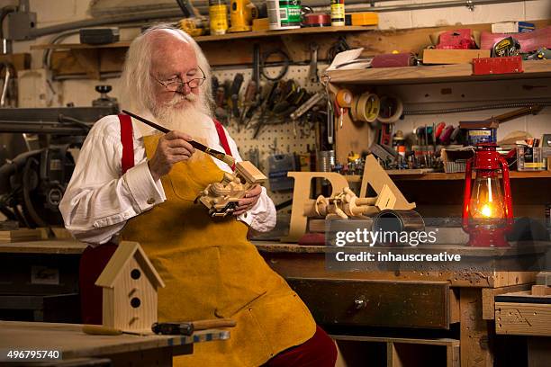 real authentic christmas photo of santa claus - santas workshop stock pictures, royalty-free photos & images