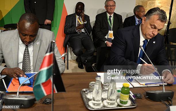 Hungary's Prime minister Viktor Orban and Kenya's Joseph Ole Nkaissery, General Secretary for Interior and Coordination of National Government, wait...