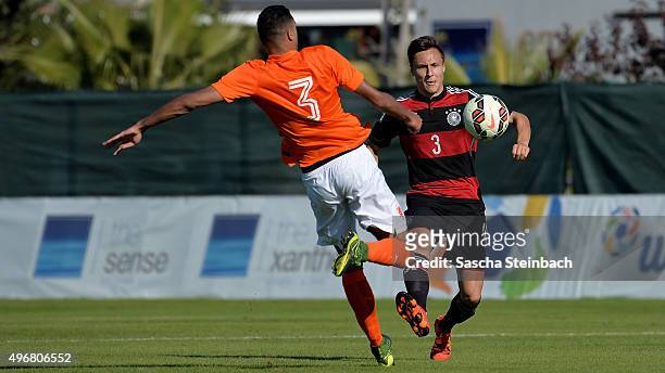 Danilho Doekhi of Netherlands and Dominik Franke of Germany compete for the ball during the U18 four nations friendly tournament match between...