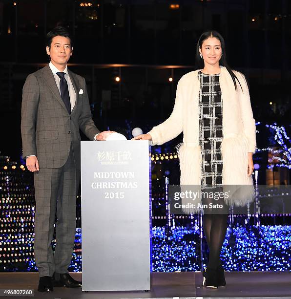 Actress Koyuki and actor Toshiaki Karasawa attend the lighting ceremony for the holiday season illumination on November 12, 2015 in Tokyo, Japan.