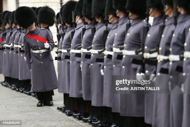 An honour guard of Scots Guards prepares to greet Indian Prime Minister Narendra Modi at treasury drum in London on November 12, 2015. India's Prime...