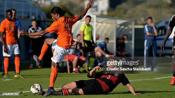 Rashaan Fernandes of Netherlands and Dominik Franke of Germany battle for the ball during the U18 four nations friendly tournament match between...