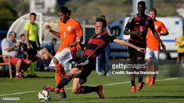 Rashaan Fernandes of Netherlands and Dominik Franke of Germany battle for the ball during the U18 four nations friendly tournament match between...