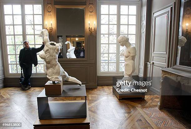 Visitor looks at the sculpture 'Fils d'Hugolin' by French sculptor Auguste Rodin at the Rodin Museum on November 12, 2015 in Paris, France. After a...