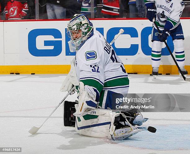 Backup goaltender Richard Bachman of the Vancouver Canucks defends the net during pregame warmups prior to the game against the New Jersey Devils at...