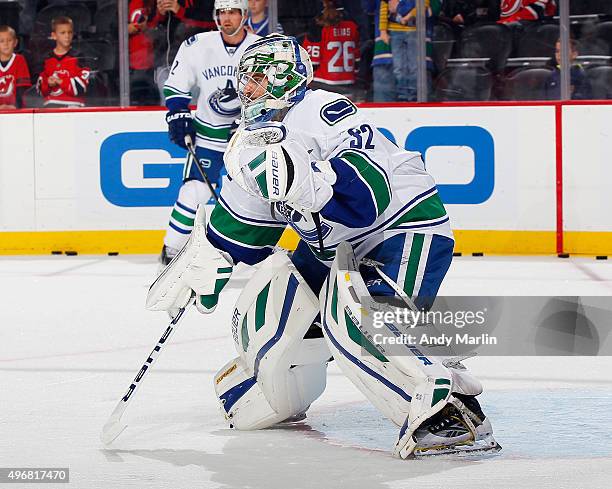 Backup goaltender Richard Bachman of the Vancouver Canucks defends the net during pregame warmups prior to the game against the New Jersey Devils at...