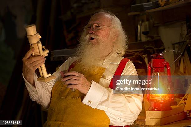 real authentic christmas photo of santa claus - santas workshop stock pictures, royalty-free photos & images