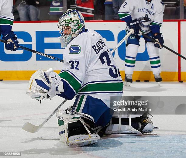 Backup goaltender Richard Bachman of the Vancouver Canucks defends the net during pregame warmups prior to the game against the New Jersey Devils at...