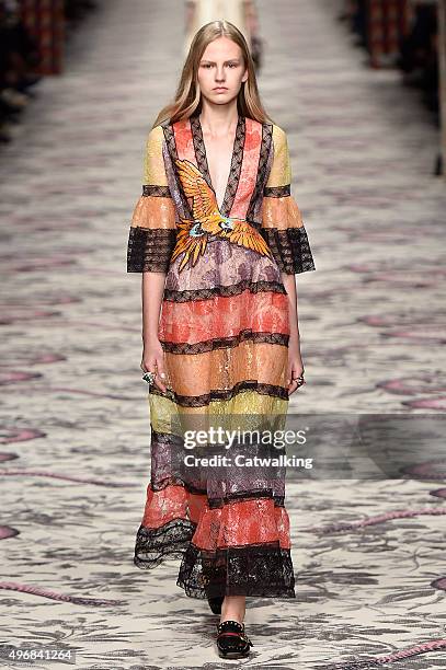 Wearing the latest lacey fabric trend, a model walks the Gucci fashion show runway at the spring summer 2016 women's ready-to-wear fashion weeks...