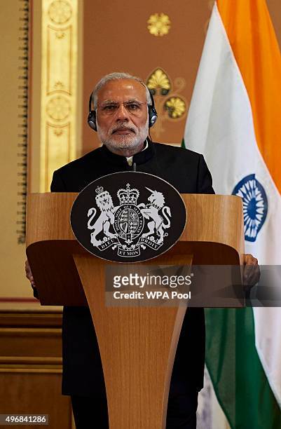 India's Prime Minister Narendra Modi is seen during a joint press conference with British Prime Minister David Cameron at the Foreign Office during...