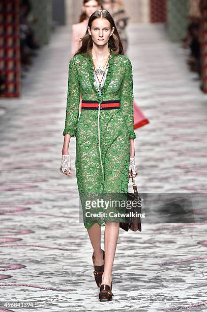 Wearing the latest lacey fabric trend, a model walks the Gucci fashion show runway at the spring summer 2016 women's ready-to-wear fashion weeks...
