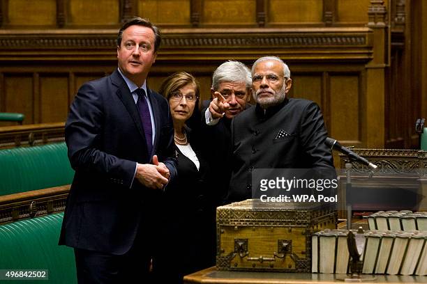 Britain's Speaker of the House of Commons John Bercow gestures standing behind the dispatch box as he, British Prime Minister David Cameron and...