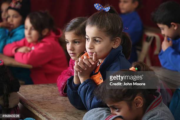 Children listen during class on November 12, 2015 in Qamishli, Rojava, Syria. With the fall of the Syrian regime and successes against ISIS in the...