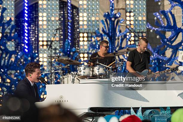 In this handout provided by Disney Parks, Charlie Puth performs during the taping of the 'Disney Parks Unforgettable Christmas Celebration' TV...