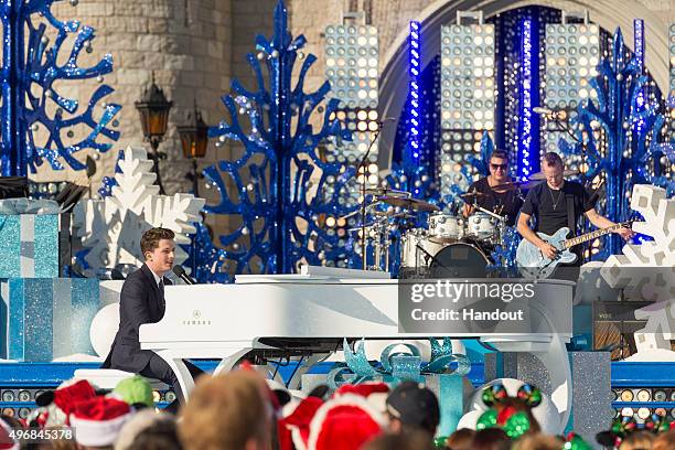 In this handout provided by Disney Parks, Charlie Puth performs during the taping of the 'Disney Parks Unforgettable Christmas Celebration' TV...