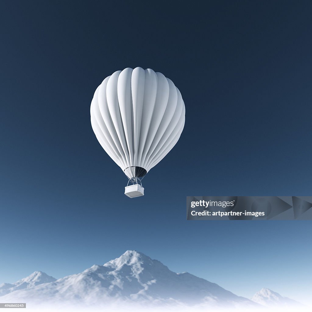 White Hot Air Balloon high in clear blue sky