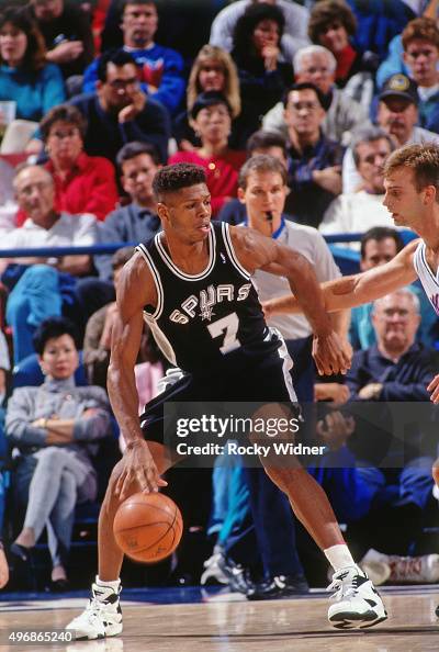 J R Reid JR Reid of the San Antonio Spurs dribbles against the Sacramento ...