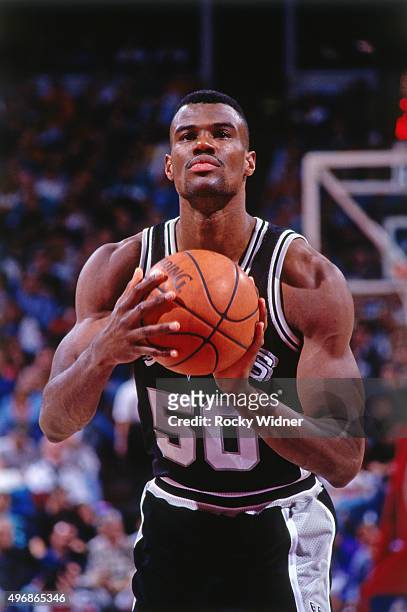 David Robinson of the San Antonio Spurs shoots a foul shot against the Sacramento Kings circa 1994 at Arco Arena in Sacramento, California. NOTE TO...