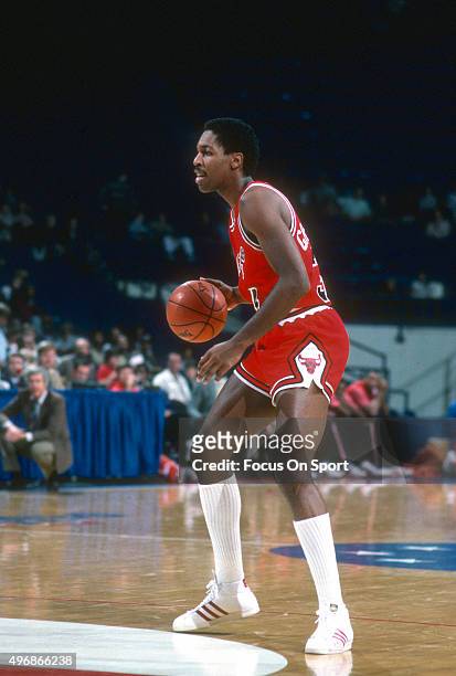 David Greenwood of the Chicago Bulls dribbles the ball against the Washington Bullets during an NBA basketball game circa 1983 at the Capital Centre...