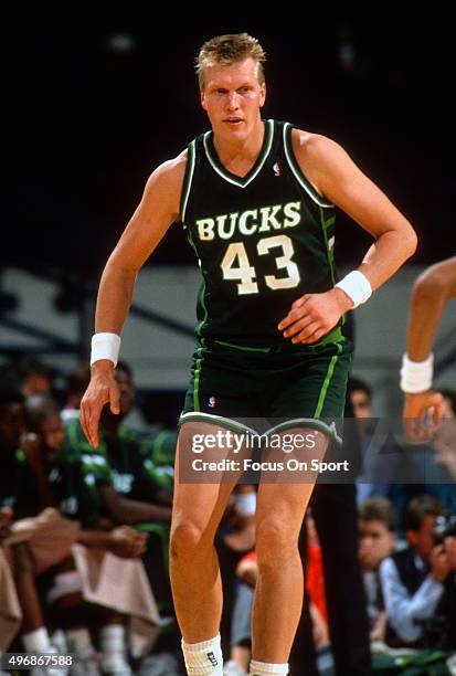 Jack Sikma of the Milwaukee Bucks looks on against the Washington Bullets during an NBA basketball game circa 1989 at the Capital Centre in Landover,...