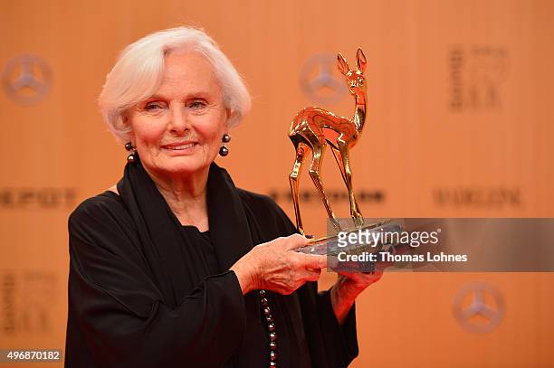 Actress Ruth Maria Kubitschek is posing with the award she accepted on behalf of producer Wolfgang Rademann at the Bambi Awards 2015 winners board at...