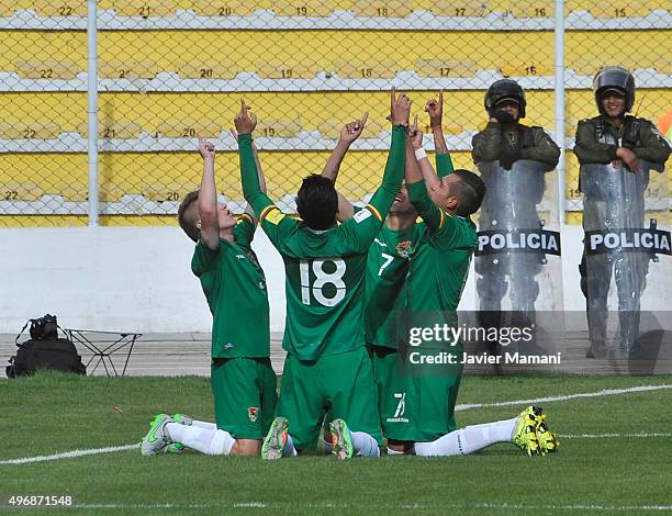 Juan Carlos Arce of Bolivia celebrates with teammates after scoring the second goal of his team during a match between Bolivia and Venezuela as part...