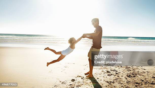 playtime with daddy - children swinging stock pictures, royalty-free photos & images