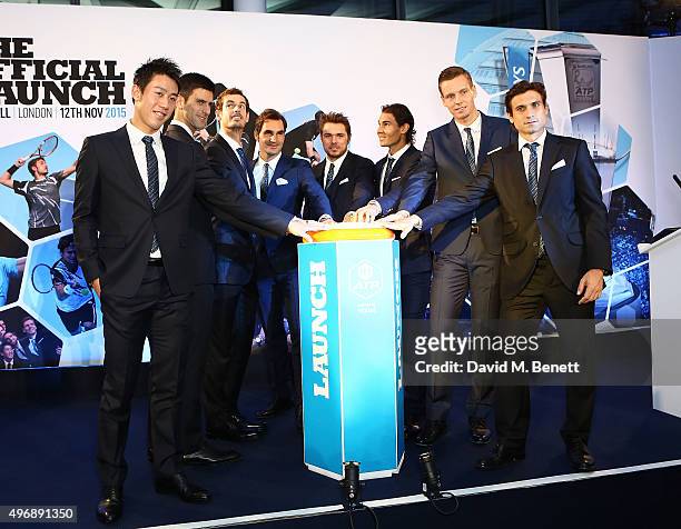 Kei Nishikori, Novak Djokovic, Andy Murray, Roger Federer, Stan Wawrinka, Rafael Nadal, Tomas Berdych and David Ferrer celebrate with Moet & Chandon...