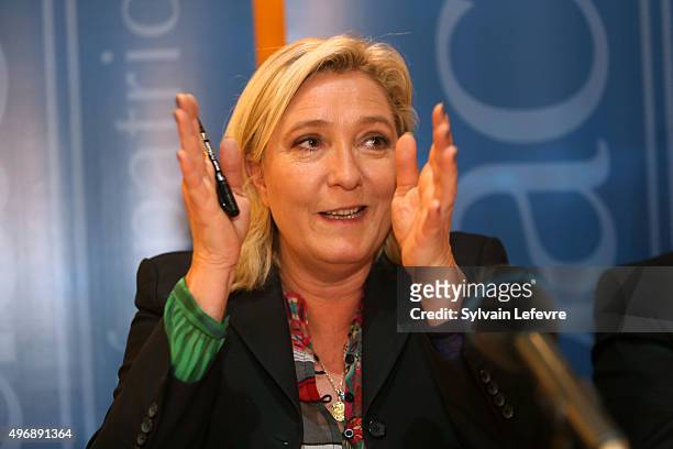 French Far-Right National Front President Marine Le Pen gestures as she talks during the press conference about 'Audace' on November 12, 2015 in...