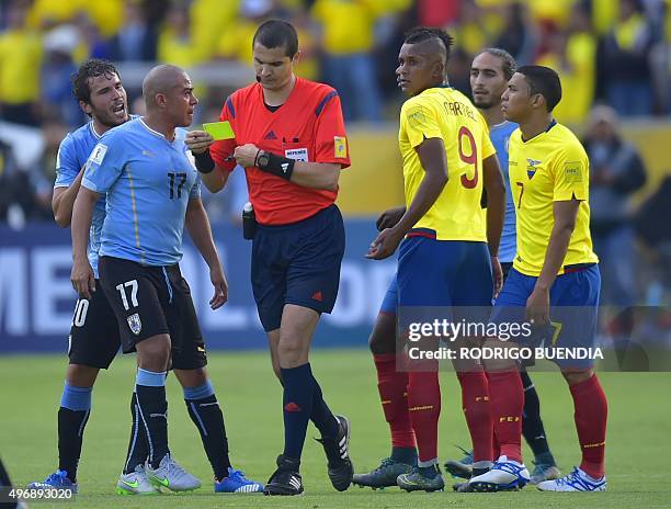 Uruguayans and Ecuadorians players argue with Brazilian referee Ricardo Marques Ribeiro during their Russia 2018 FIFA World Cup South American...