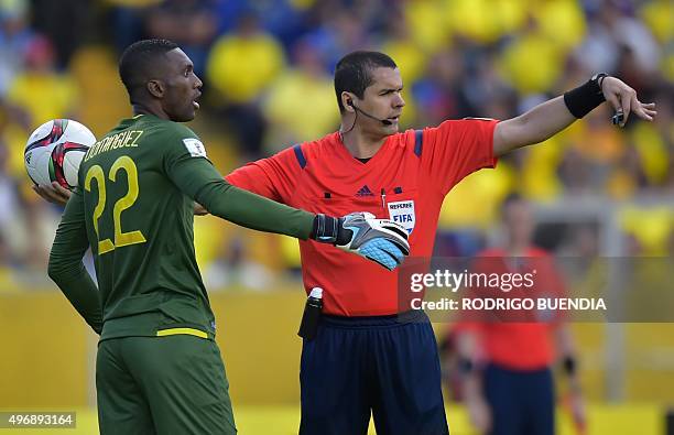 Ecuador's goalie Alexander Domingues argues with Brazilian referee Ricardo Marques Ribeiro during their Russia 2018 FIFA World Cup South American...