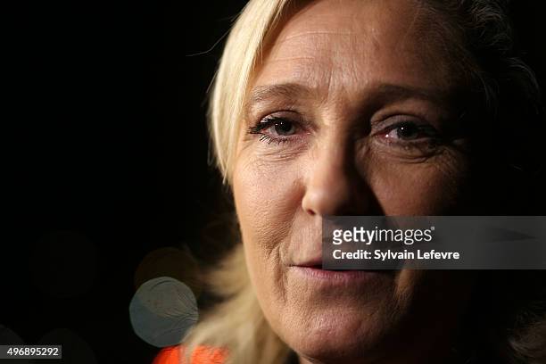 French Far-Right National Front President Marine Le Pen talks with journalists during the press conference about the collective Audace on November...