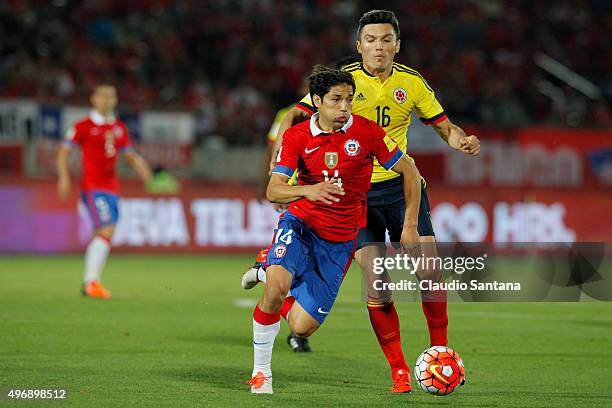 Matias Fernandez of Chile fights the ball with Daniel Torres of Colombia during a match between Chile and Colombia as part of FIFA 2018 World Cup...