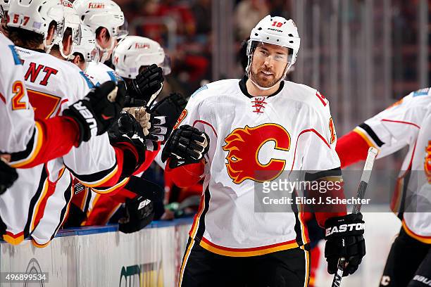 David Jones of the Calgary Flames celebrates a goal with teammates against the Florida Panthers at the BB&T Center on November 10, 2015 in Sunrise,...