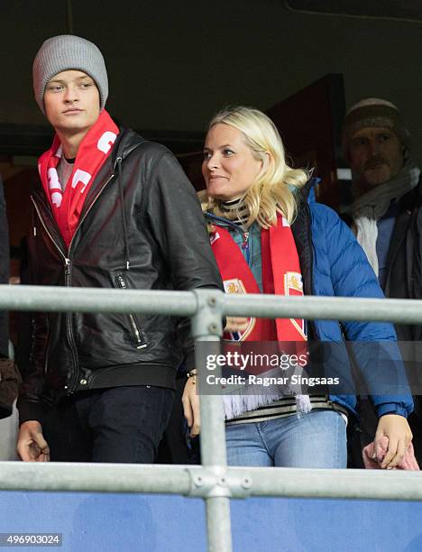 Marius Borg Hoiby and Crown Princess Mette-Marit of Norway attend the Play Off Game Between Norway and Hungary on November 12, 2015 in Oslo, Norway.