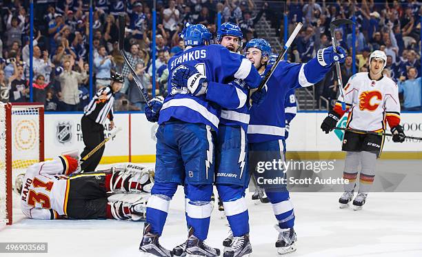 Steven Stamkos of the Tampa Bay Lightning celebrates his goal with teammates Alex Killorn and Tyler Johnson against goalie Karri Ramo and Mikael...