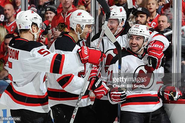 Kyle Palmieri of the New Jersey Devils celebrates with Adam Larsson, Travis Zajac and Sergey Kalinin after scoring in the second period of the NHL...
